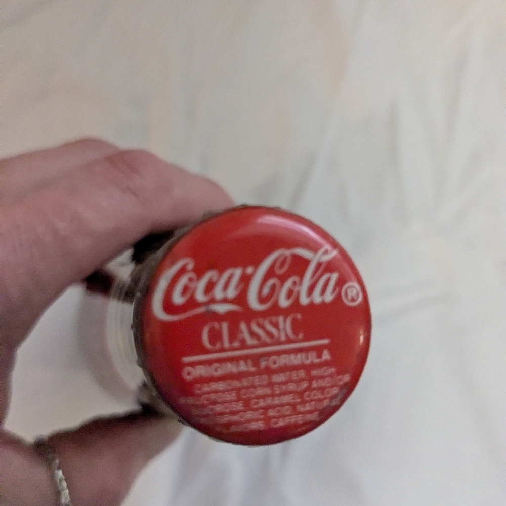Coca-Cola Commemorative Bottles with Red and Blue Labels
